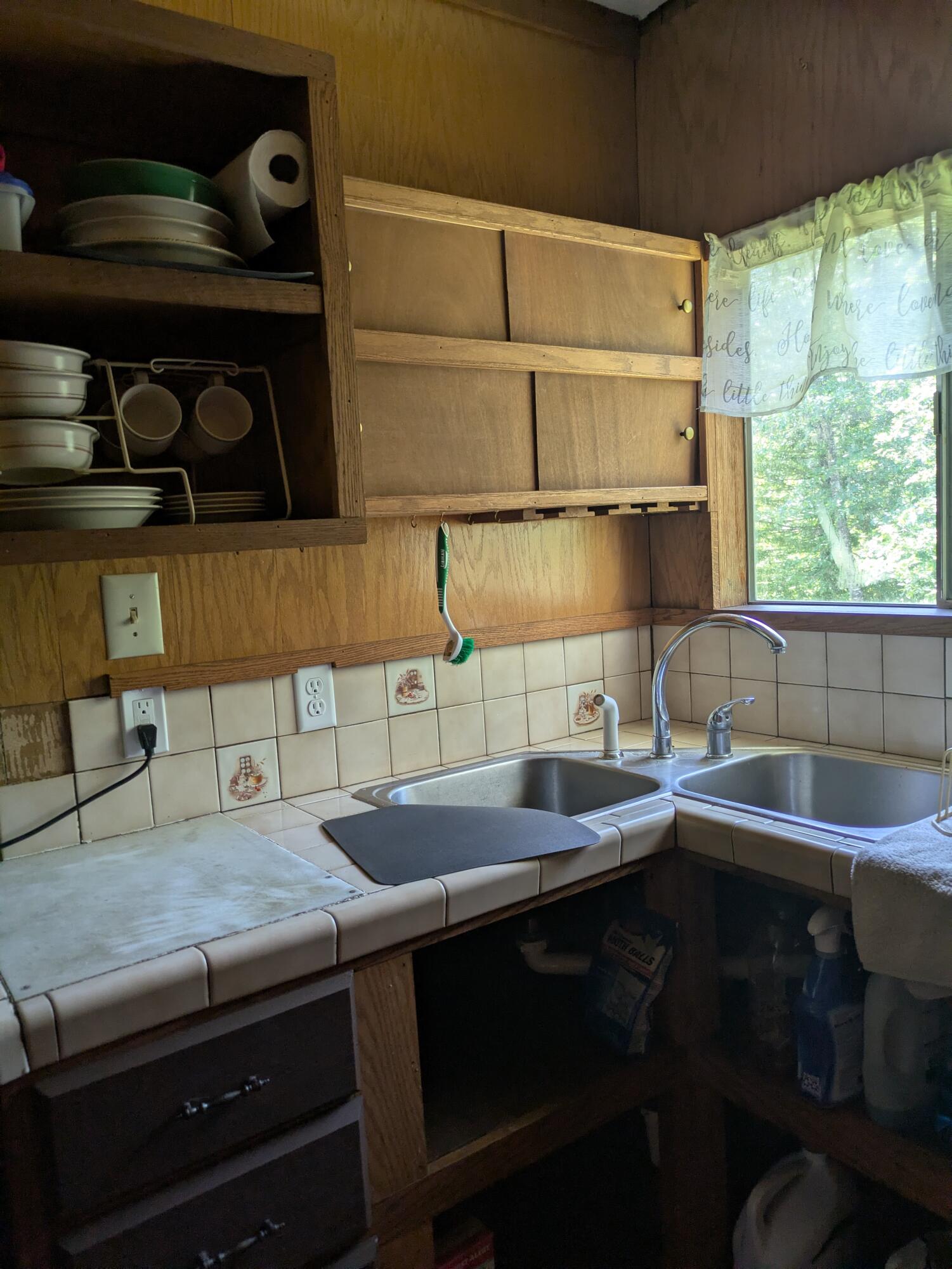 575 Kirkham Road Cave Junction, OR 97523 - Photo 39 of 45 a kitchen with a sink and a stove next to a window
