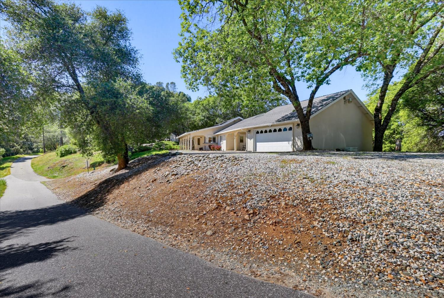 18639 Fay Ridge Court Grass Valley, CA 95949 - Photo 84 of 99 a front view of a house with a yard and trees