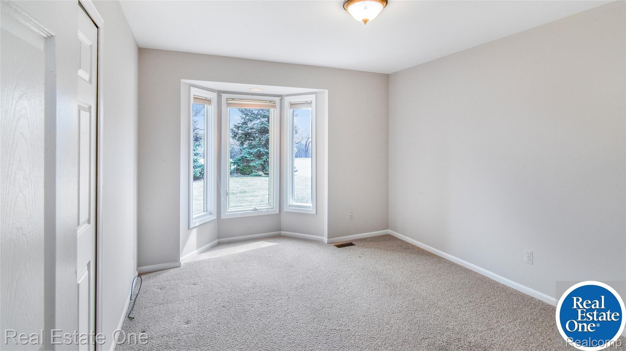 19449 Newburgh Road Livonia, MI 48152 - Photo 17 of 41 Bedroom #1 with bay windows would also make a lovely study.