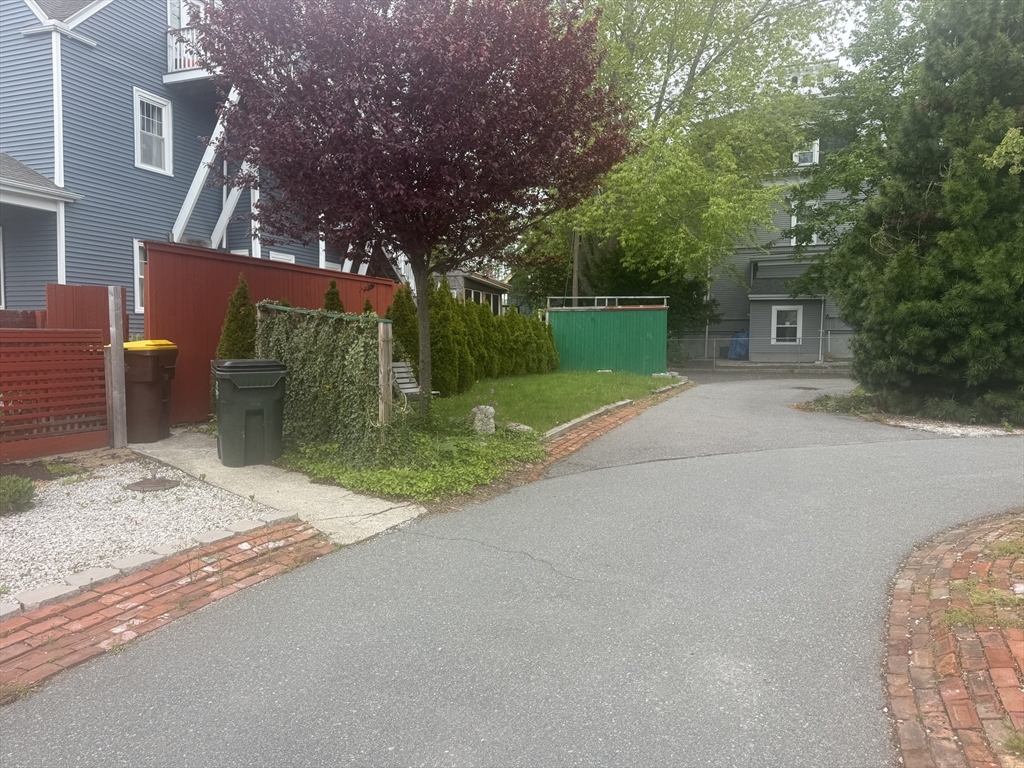 39 Belmont Street, Unit 2 Fall River, MA 02720 - Photo 3 of 10 front view of a house with a yard and an trees