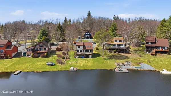 an aerial view of residential houses with outdoor space