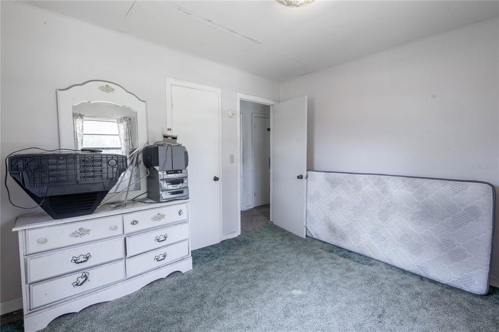 6281 Southeast Hames Road Belleview, FL 34420 - Photo 6 of 16 a kitchen with white cabinets and sink