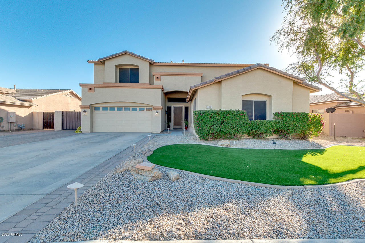 3315 East Los Altos Road Gilbert, AZ 85297 - Photo 1 of 66 a front view of a house with a yard and garage