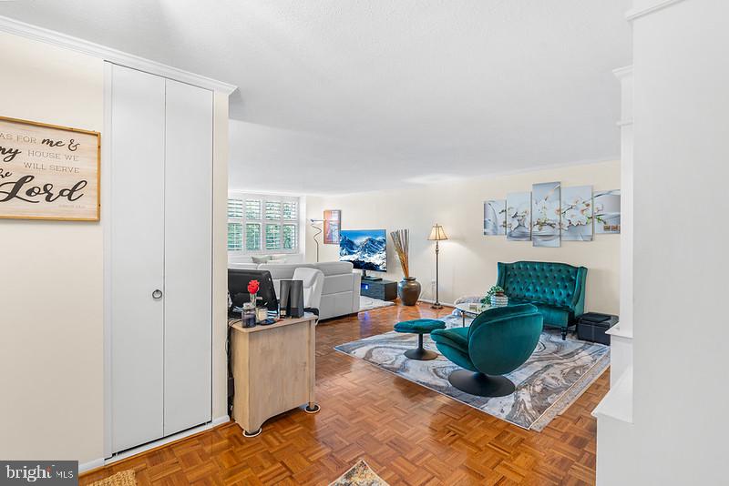 7301 Coventry Avenue, Unit 502 Elkins Park, PA 19027 - Photo 3 of 16 a living room with furniture a rug and white walls