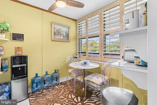 a dining room with furniture and wooden floor