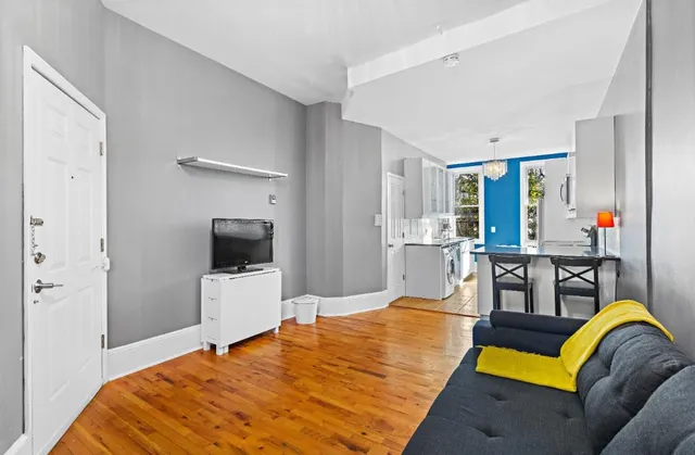 a bedroom with a bed and a flat screen television