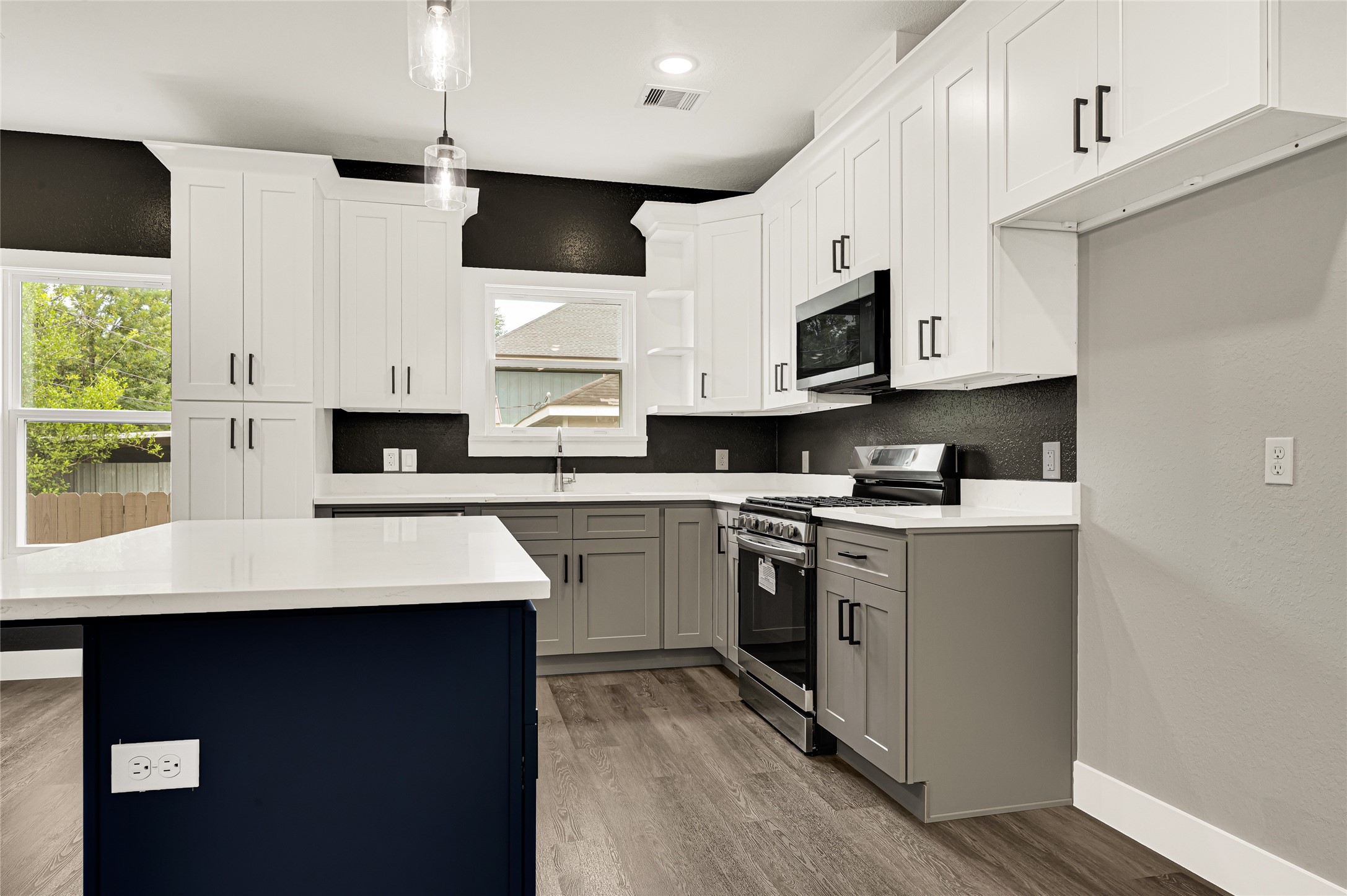 5930 Boness Road, Unit A & B Houston, TX 77396 - Photo 12 of 43 This kitchen and bathroom renovation features upgraded premium 3cm quartz countertops, providing superior durability and a more substantial, high-end aesthetic than the standard 2cm thickness found in most homes.