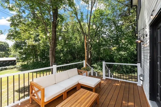 a view of balcony with deck and wooden floor