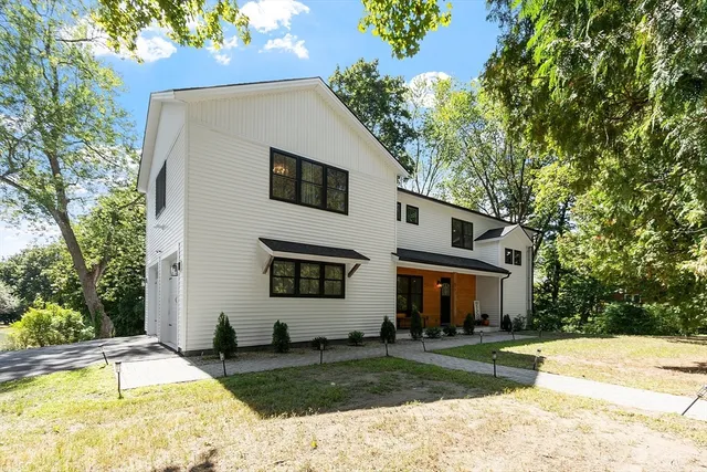 a front view of a house with a yard