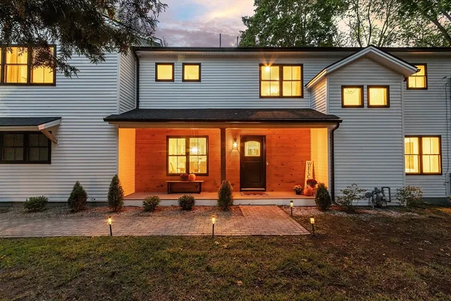 a front view of a house with a yard