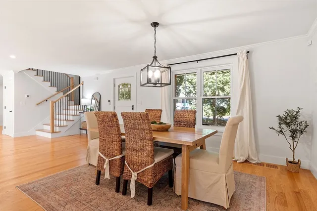 a view of a dining room with furniture window and wooden floor