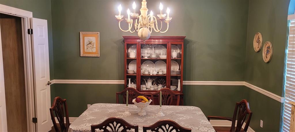 9834 East Chase Circle Shreveport, LA 71118 - Photo 14 of 23 a view of a dining room with furniture and chandelier