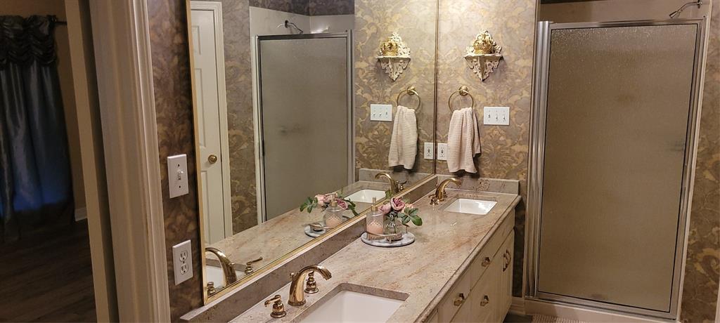 9834 East Chase Circle Shreveport, LA 71118 - Photo 18 of 23 a bathroom with a sink vanity mirror and a shower