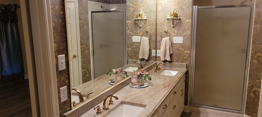 9834 East Chase Circle Shreveport, LA 71118 - Photo 19 of 23 a bathroom with a sink vanity granite and shower