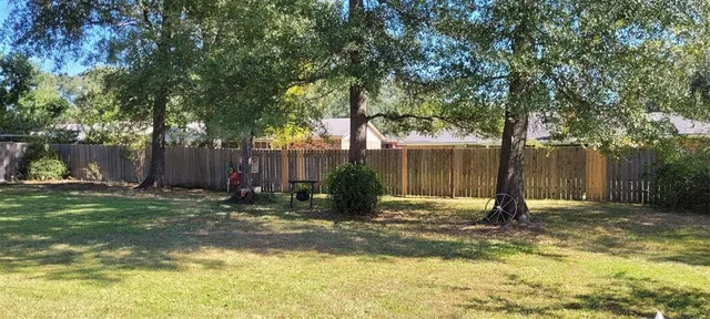 a view of a backyard with tree s