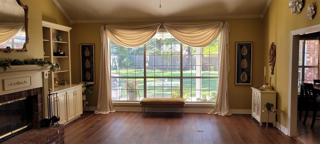 9834 East Chase Circle Shreveport, LA 71118 - Photo 6 of 23 a livingroom with furniture a fireplace and wooden floor