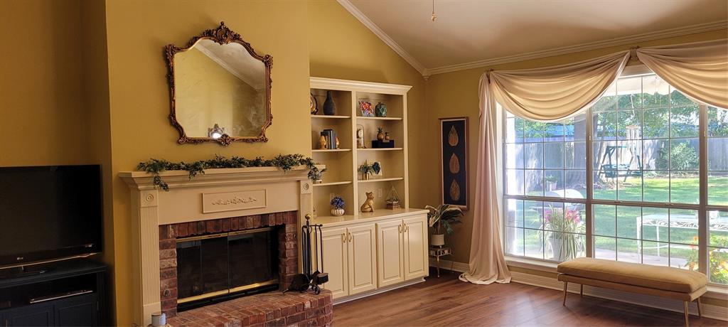 9834 East Chase Circle Shreveport, LA 71118 - Photo 7 of 23 a bedroom with a bed and a fireplace