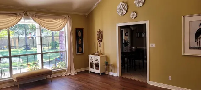 a room with window and wooden floor