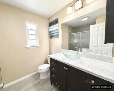 a bathroom with a shower and a toilet