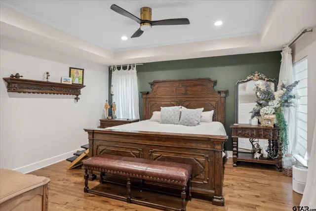 a bedroom with furniture and a window