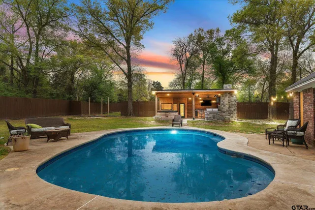 a view of a swimming pool with a sitting space