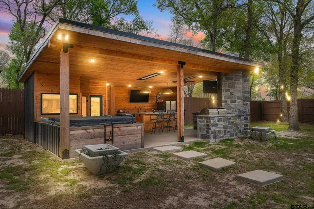 a view of a patio with table and chairs and potted plants