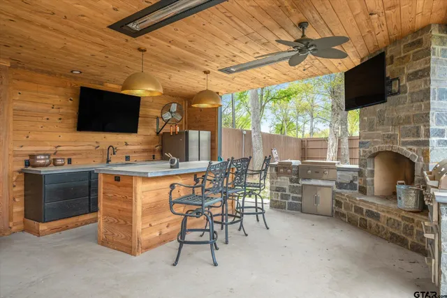 a view of a livingroom with furniture and a fireplace