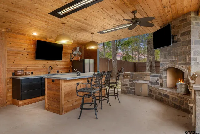 a view of a livingroom with furniture flat screen tv and outdoor view