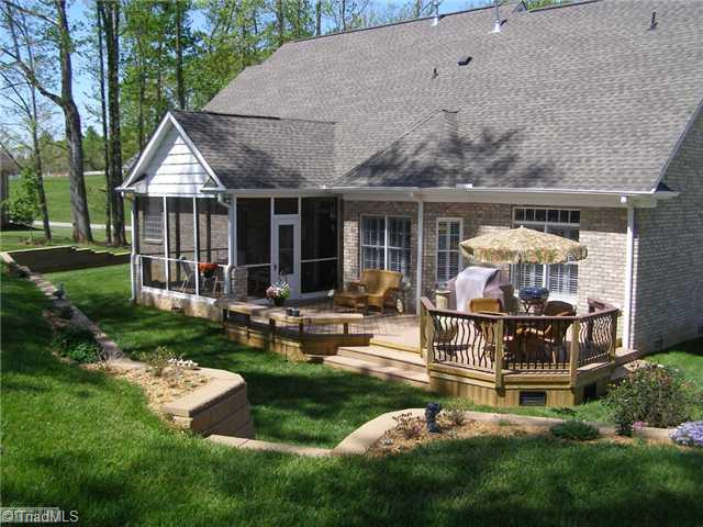 602 Stafford Pointe Court Oak Ridge, NC 27310 - Photo 15 of 16 Exterior Back. Screen Porch and Trex Decking for outside enjoyment