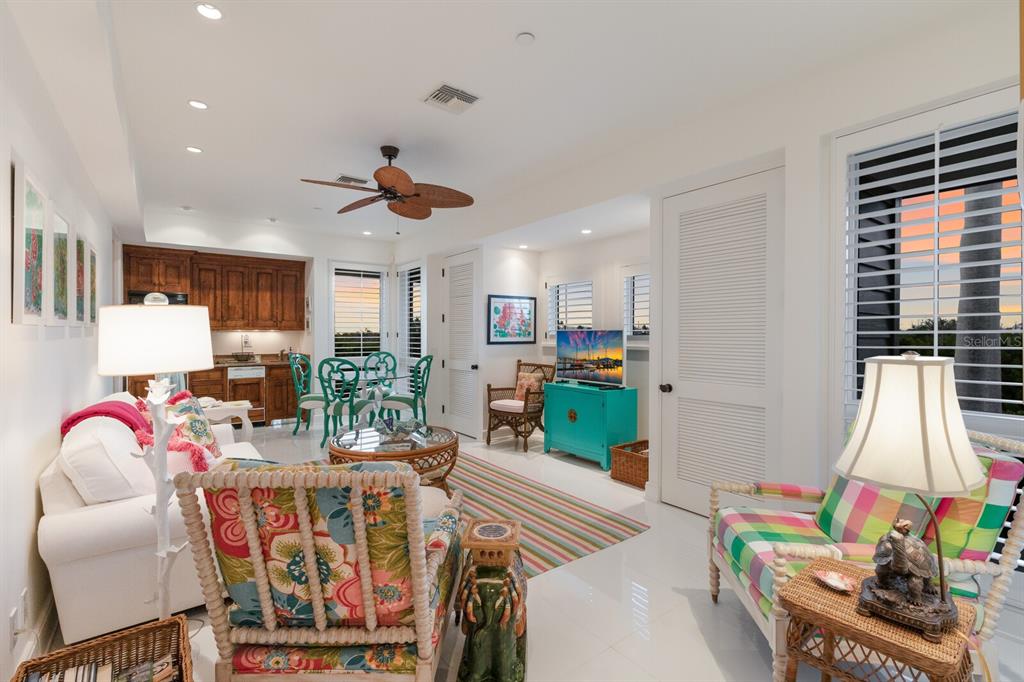 641 Boca Bay Drive Boca Grande, FL 33921 - Photo 30 of 74 a living room with furniture a flat screen tv and a window