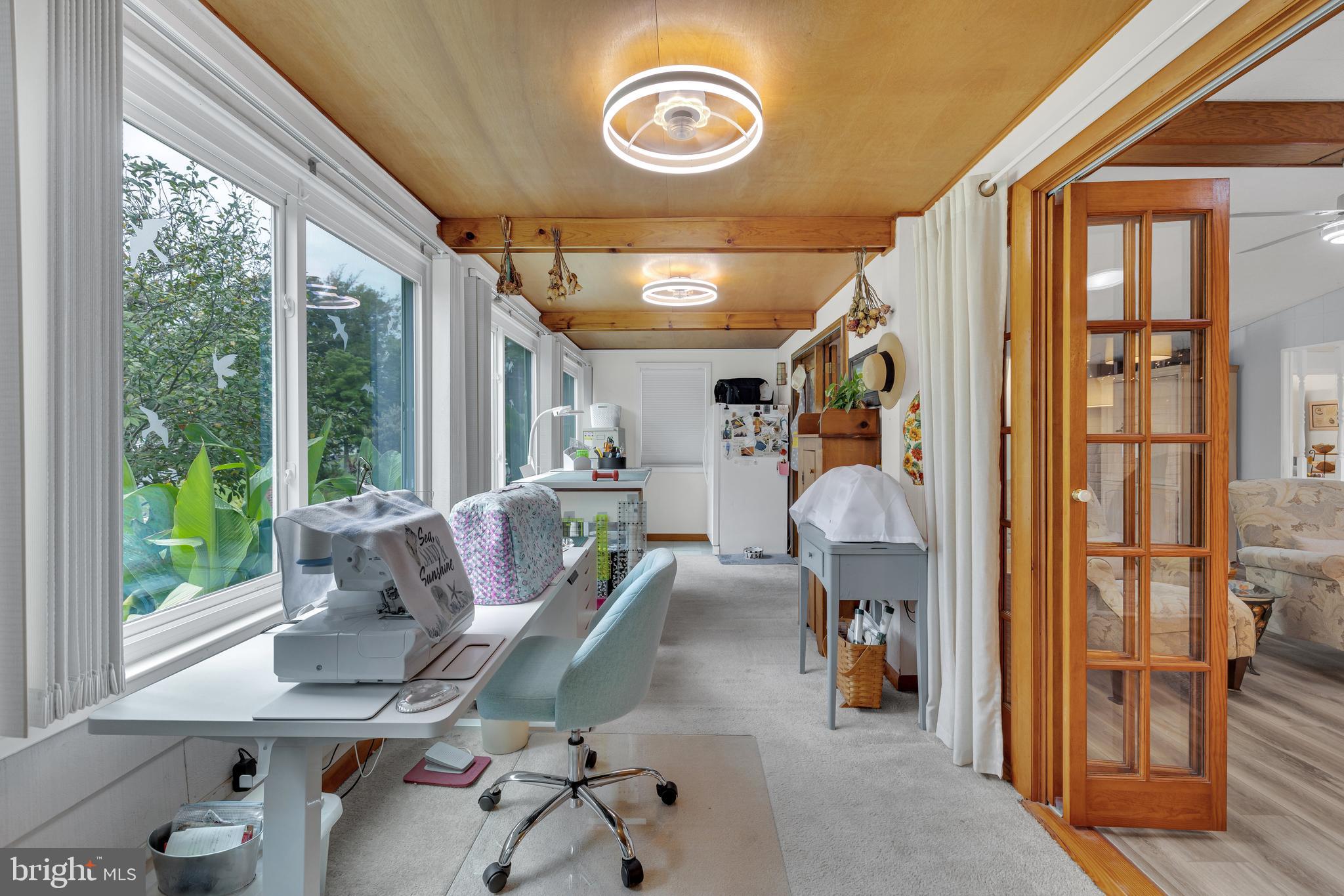 30879 Maplewood Road Ocean View, DE 19970 - Photo 12 of 41 a living room with furniture and a table