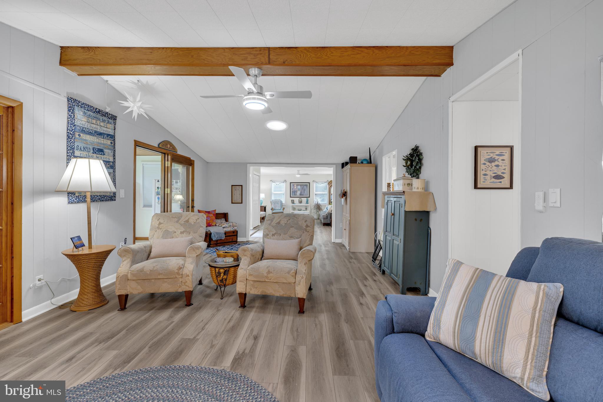 30879 Maplewood Road Ocean View, DE 19970 - Photo 14 of 41 a living room with furniture and a lamp