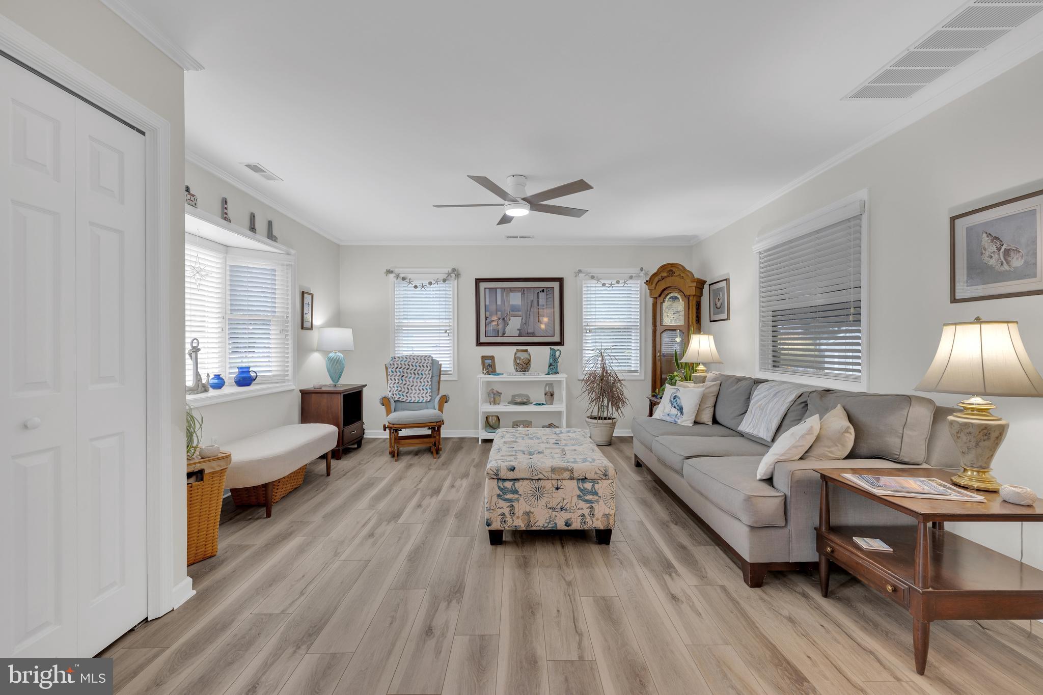 30879 Maplewood Road Ocean View, DE 19970 - Photo 15 of 41 a living room with furniture and a wooden floor