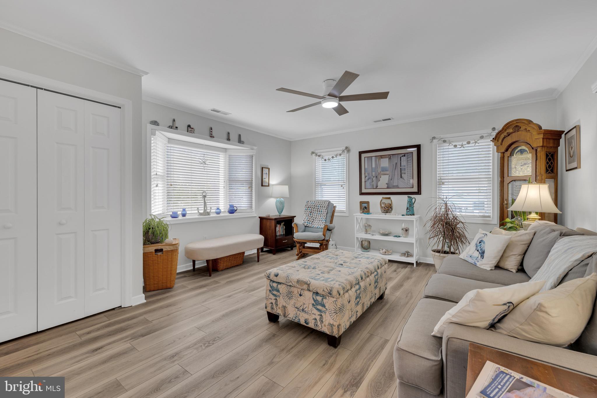 30879 Maplewood Road Ocean View, DE 19970 - Photo 16 of 41 a bedroom with furniture and wooden floor