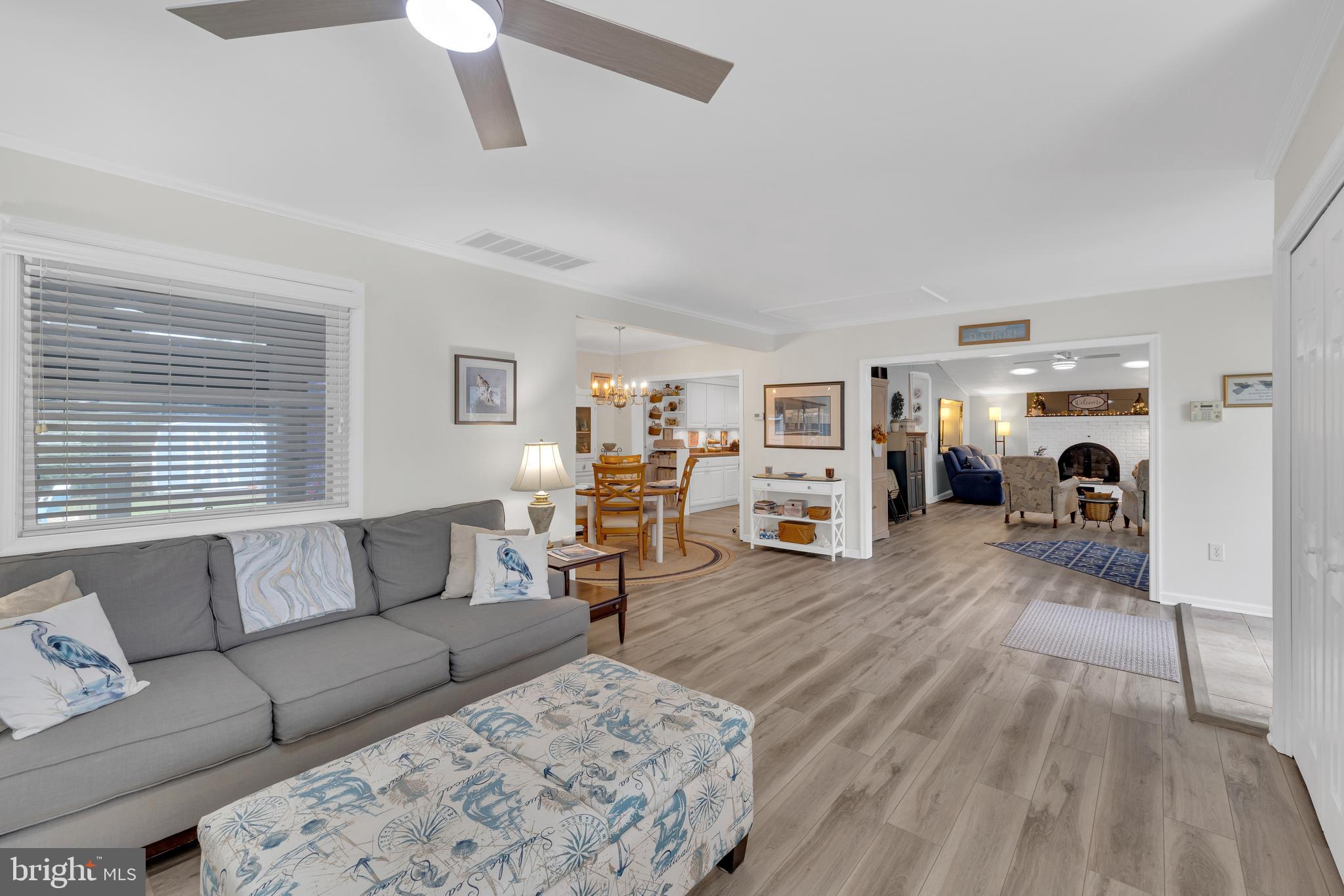 30879 Maplewood Road Ocean View, DE 19970 - Photo 17 of 41 a living room with furniture and a fireplace