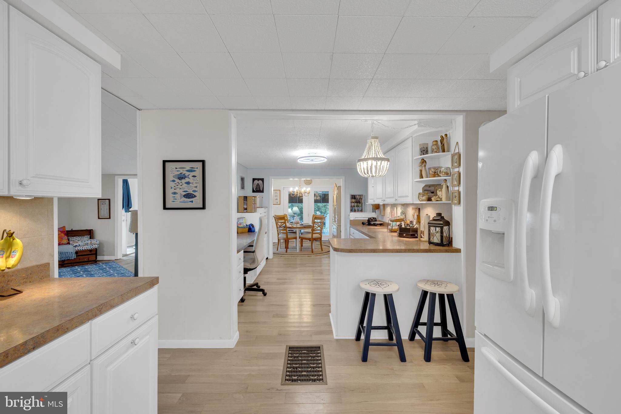 30879 Maplewood Road Ocean View, DE 19970 - Photo 18 of 41 a kitchen with stainless steel appliances granite countertop a refrigerator and microwave