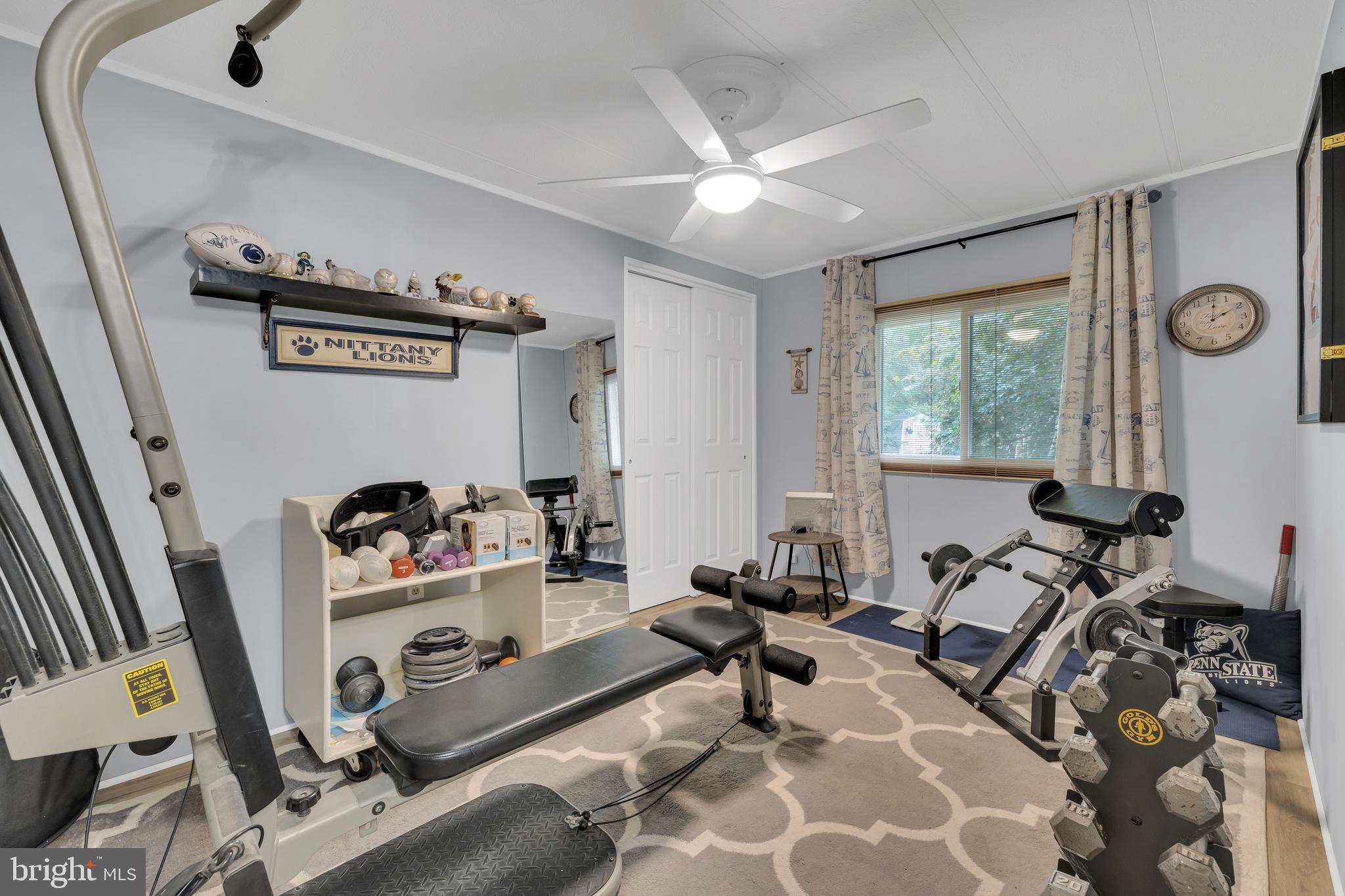 30879 Maplewood Road Ocean View, DE 19970 - Photo 29 of 41 a room with gym equipment and a large mirror