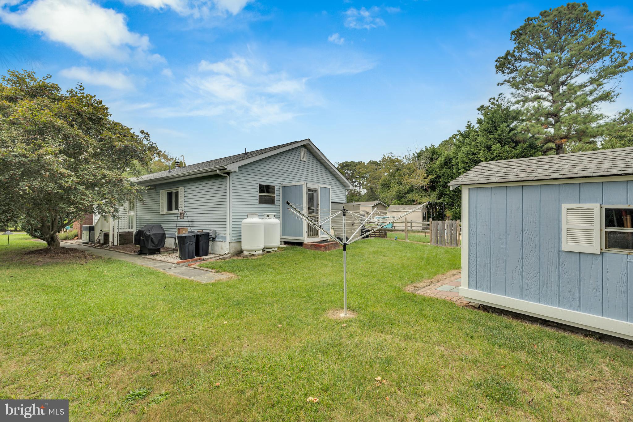 30879 Maplewood Road Ocean View, DE 19970 - Photo 36 of 41 a view of a house with backyard and trees