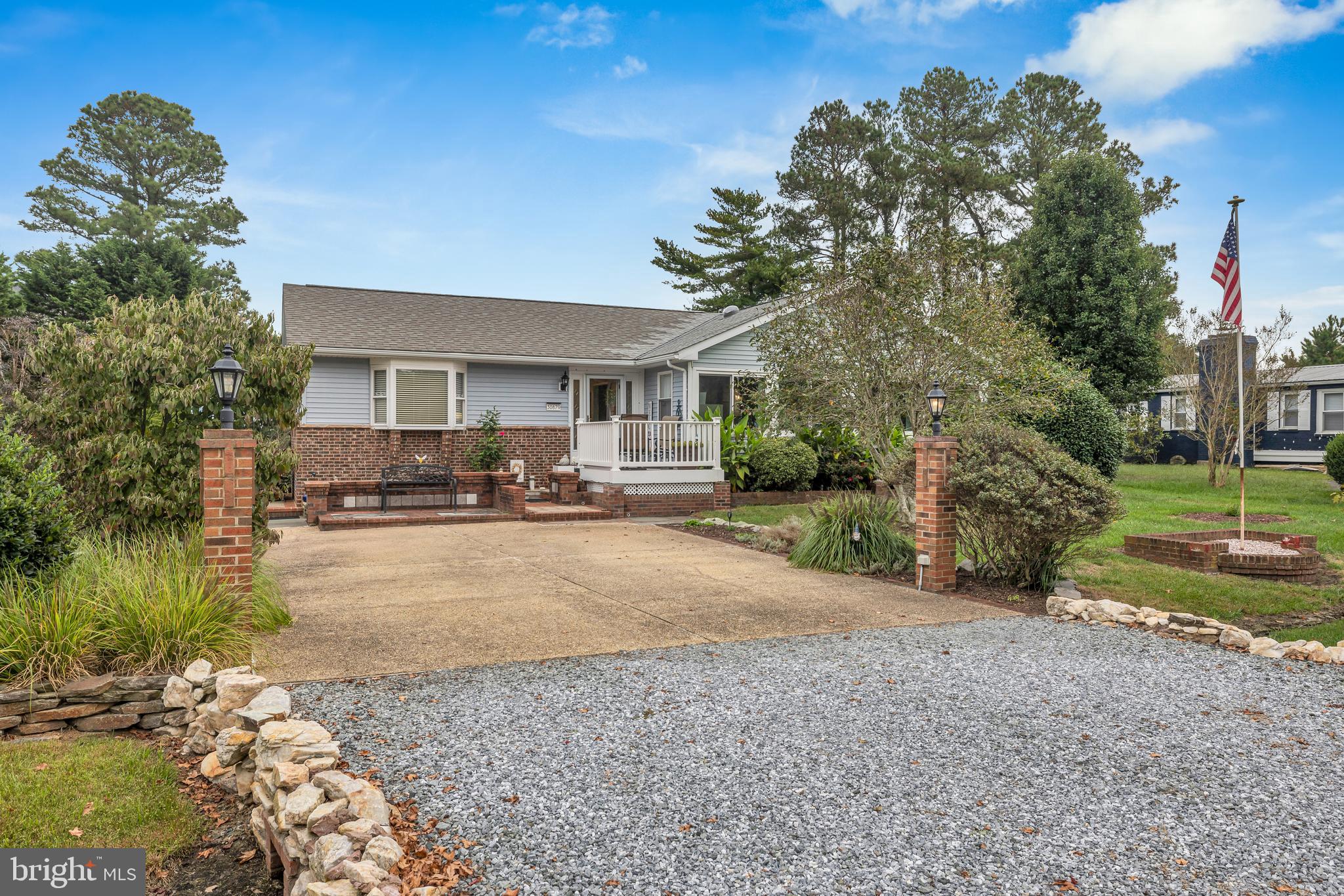 30879 Maplewood Road Ocean View, DE 19970 - Photo 5 of 41 a view of a house with a yard and large tree