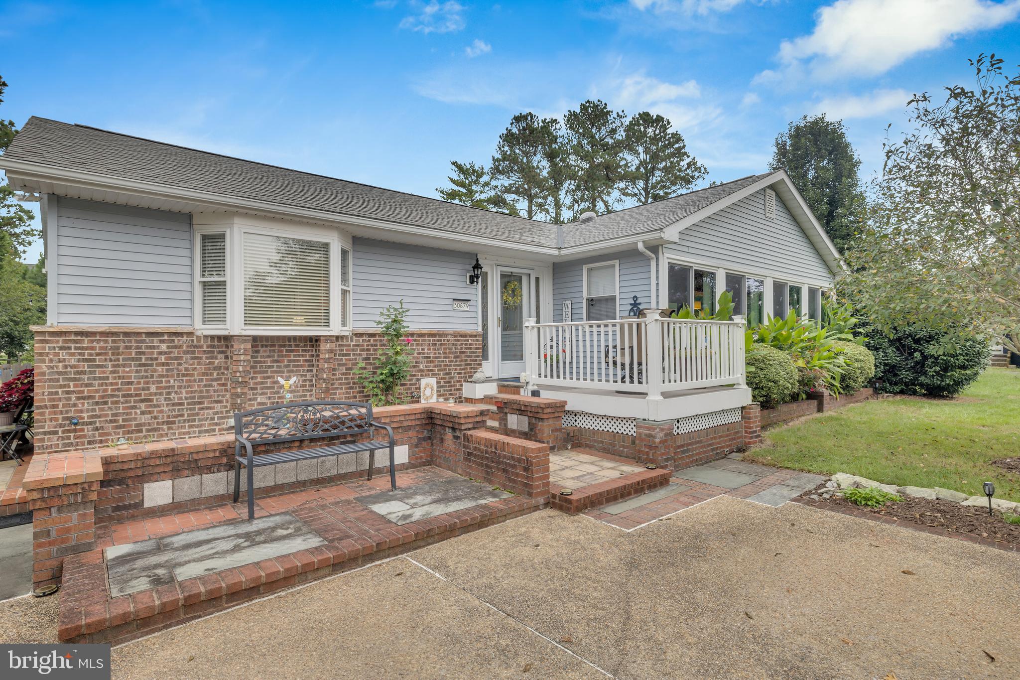 30879 Maplewood Road Ocean View, DE 19970 - Photo 9 of 41 a view of a house with a patio