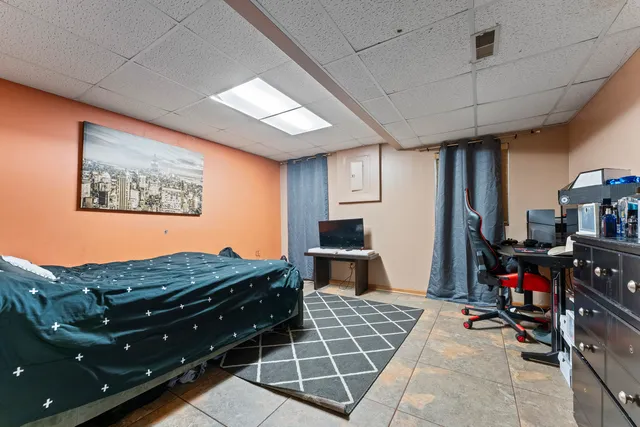 a room with gym equipment and a window