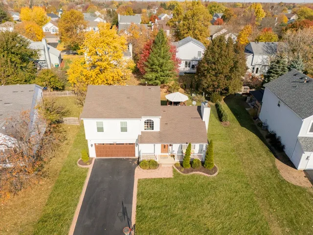 an aerial view of residential houses with outdoor space
