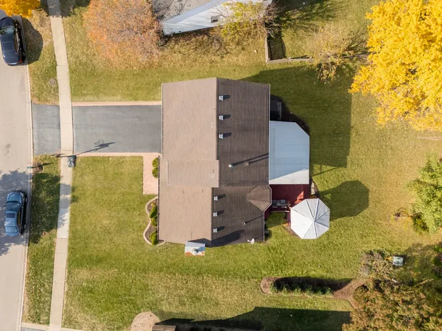 an aerial view of residential house with swimming pool