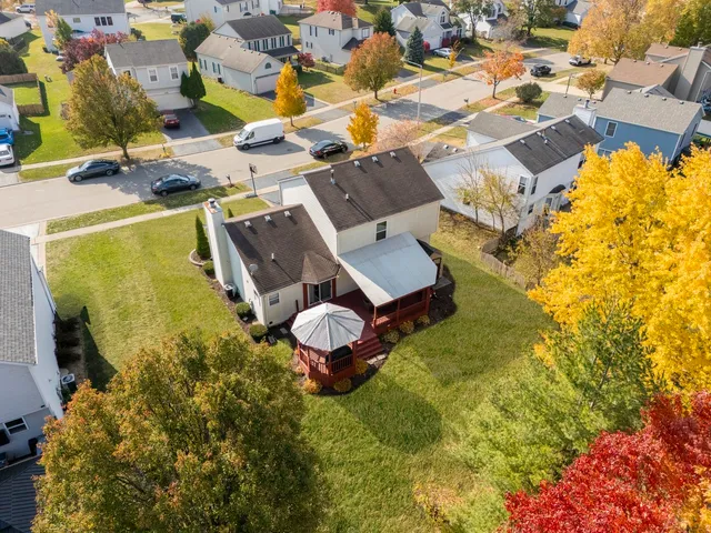 an aerial view of residential houses with swimming pool