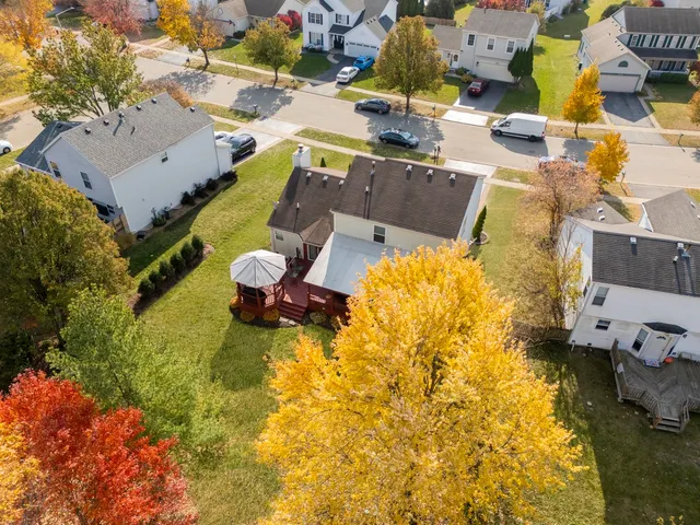 an aerial view of residential houses with outdoor space