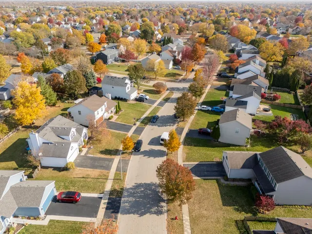 an aerial view of residential houses with outdoor space