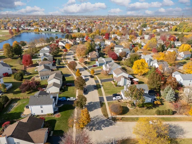 an aerial view of residential houses with outdoor space