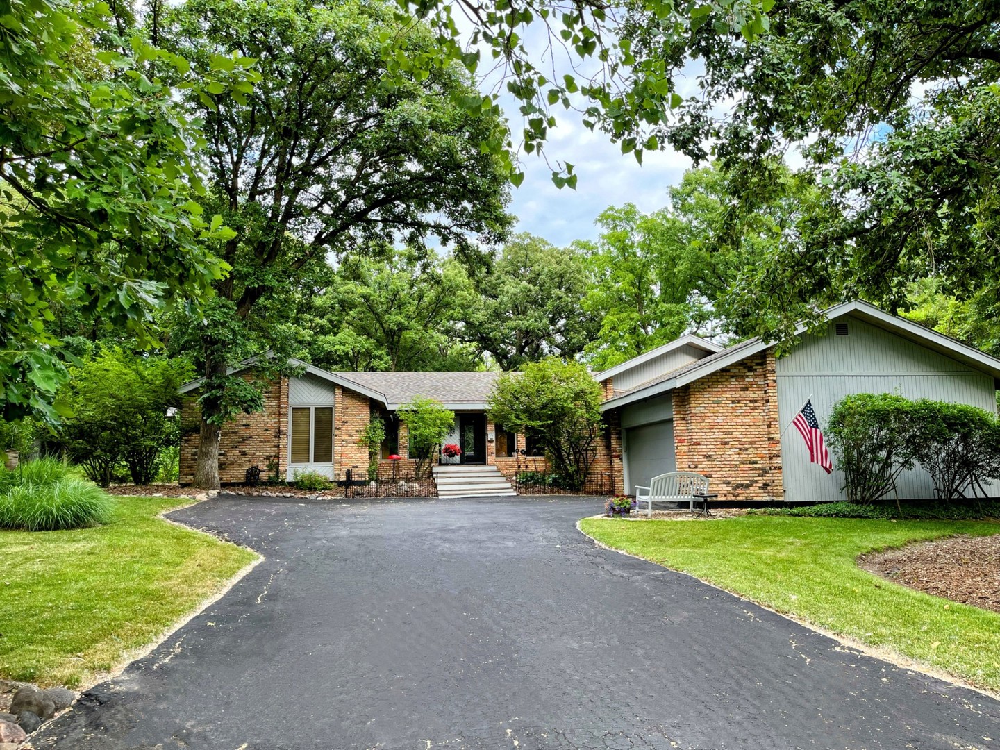 a car parked in front of house with a yard