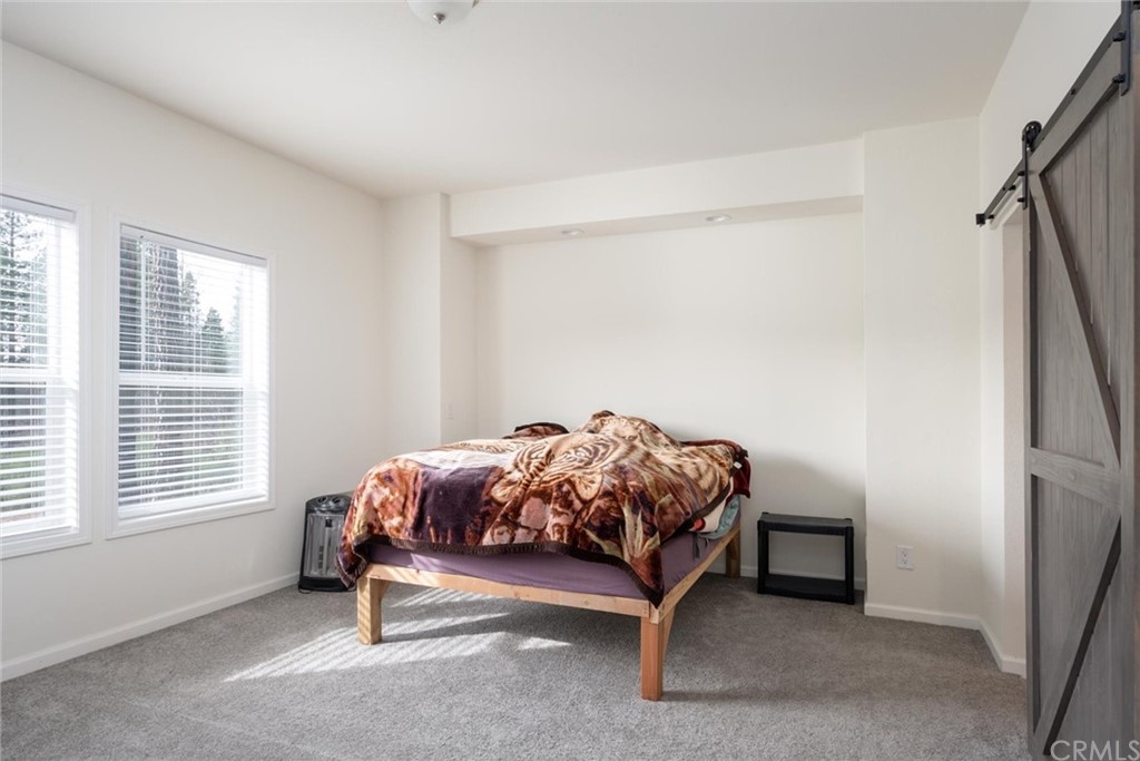 12980 Mohawk Way Concow, CA 95965 - Photo 15 of 26 a bedroom with a bed and a window