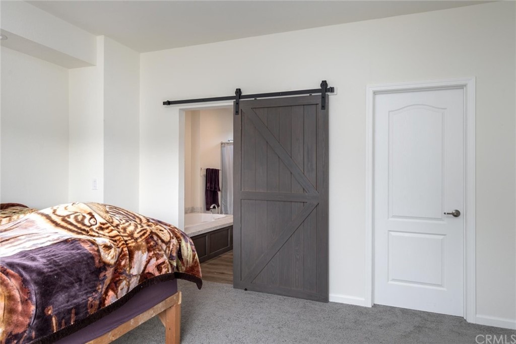 12980 Mohawk Way Concow, CA 95965 - Photo 16 of 26 a bedroom with a bed and a cabinet